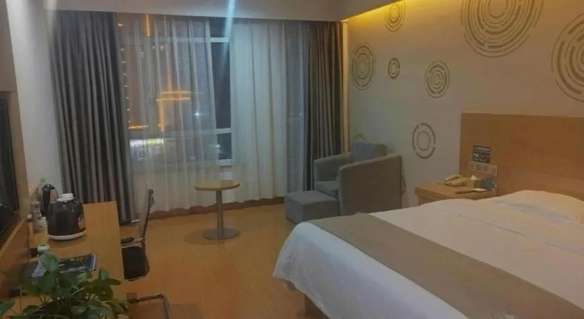 Bed in GreenTree Inn Shandong Heze Caoxian Zhuangzhai Town Oriental Times City Business Hotel