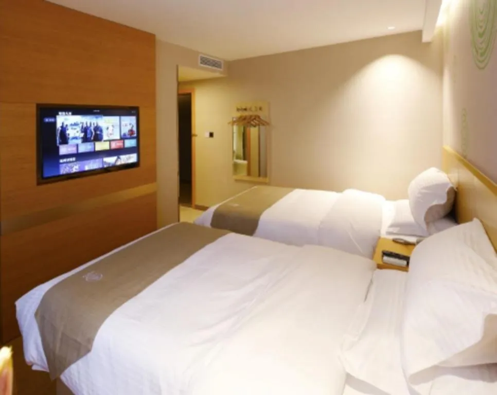 Bed in GreenTree Inn Shandong Heze Caoxian Zhuangzhai Town Oriental Times City Business Hotel