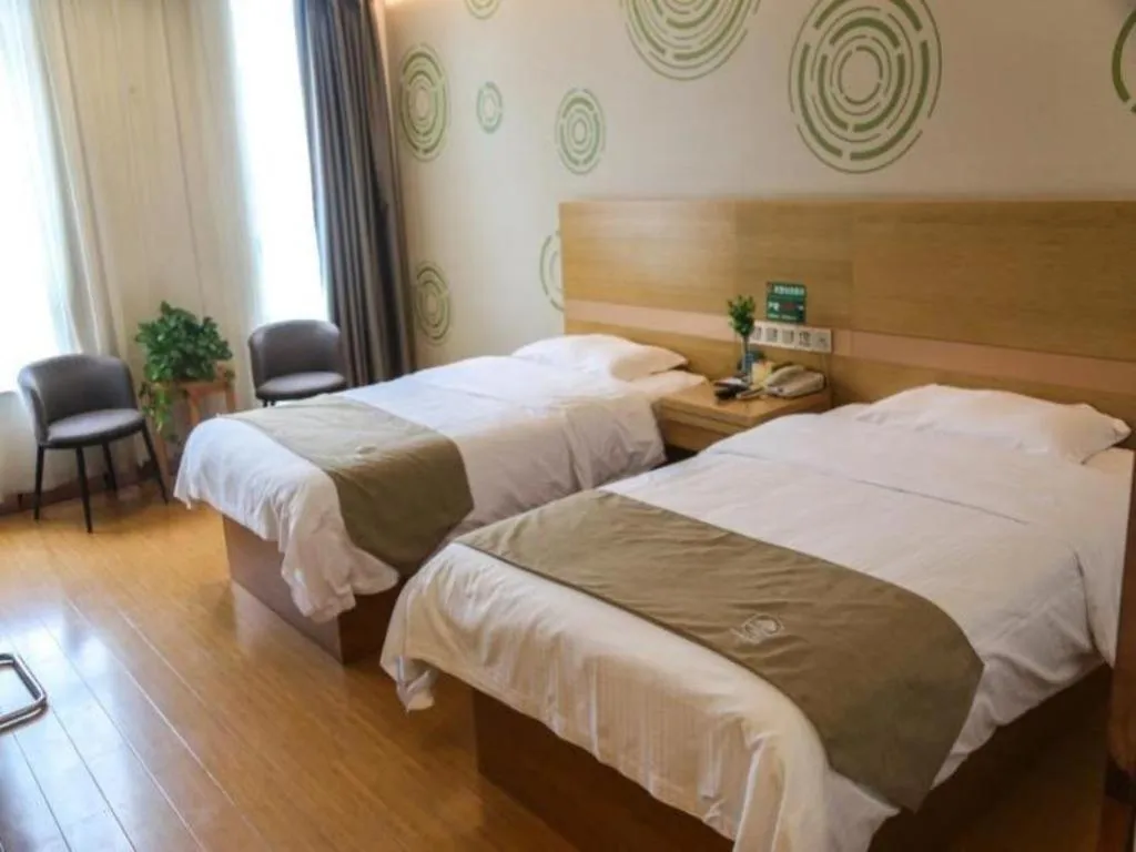 Bed in GreenTree Inn Shandong Heze Caoxian Zhuangzhai Town Oriental Times City Business Hotel