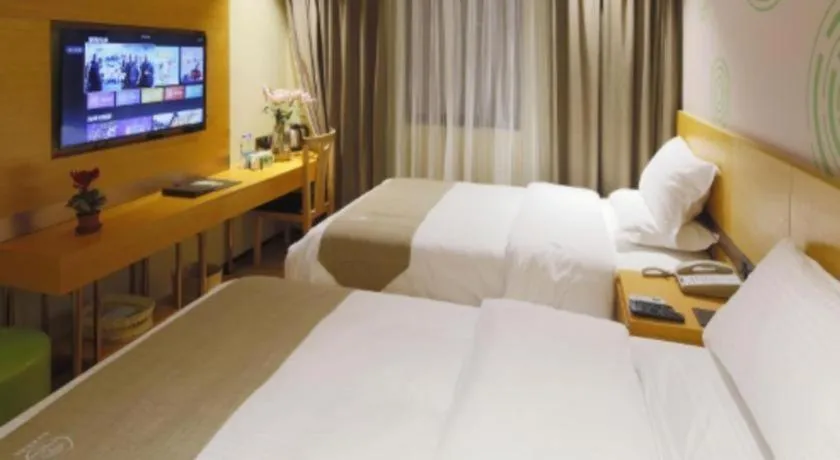 Bed in GreenTree Inn Shandong Heze Caoxian Zhuangzhai Town Oriental Times City Business Hotel