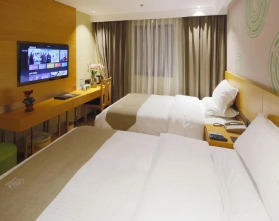 Bed in GreenTree Inn Shandong Heze Caoxian Zhuangzhai Town Oriental Times City Business Hotel