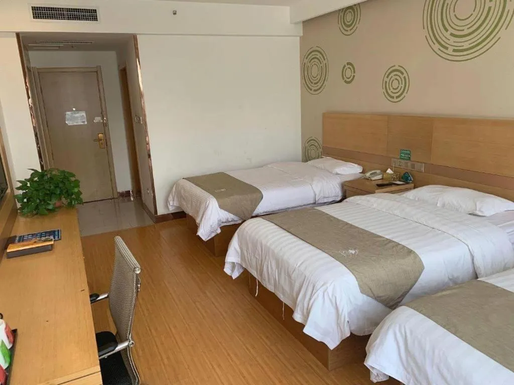 Bed in GreenTree Inn Shandong Heze Caoxian Zhuangzhai Town Oriental Times City Business Hotel