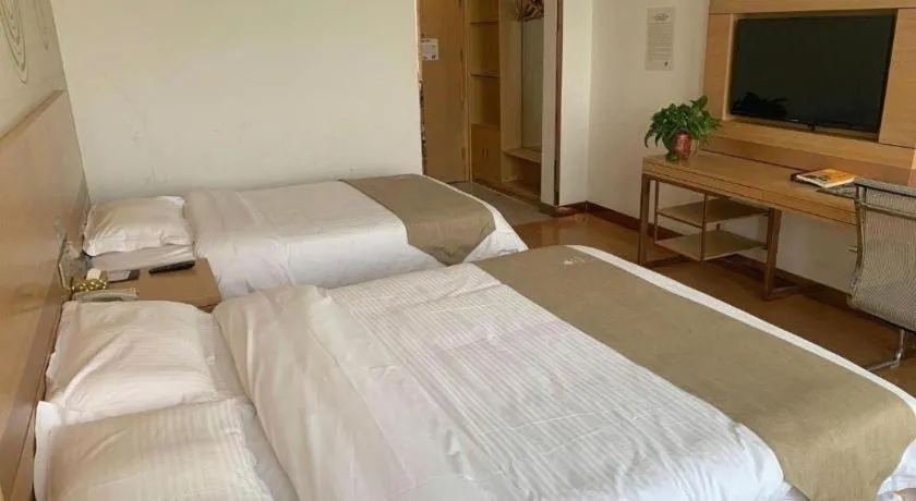 Bed in GreenTree Inn Shandong Heze Caoxian Zhuangzhai Town Oriental Times City Business Hotel