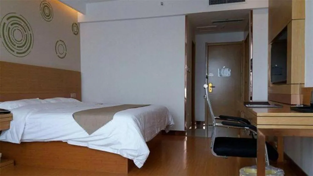 Bed in GreenTree Inn Shandong Heze Caoxian Zhuangzhai Town Oriental Times City Business Hotel