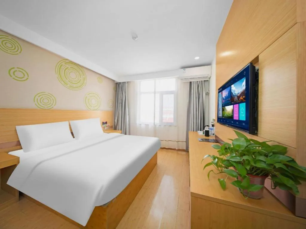 Bed in GreenTree Inn Binzhou Wudi County Yinzuo Plaza Express Hotel
