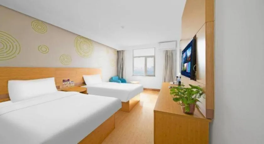 Bed in GreenTree Inn Binzhou Wudi County Yinzuo Plaza Express Hotel