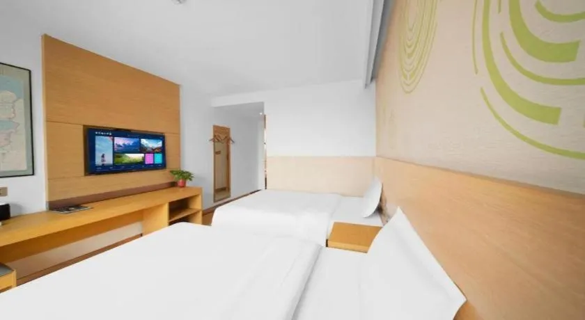 Bed in GreenTree Inn Binzhou Wudi County Yinzuo Plaza Express Hotel