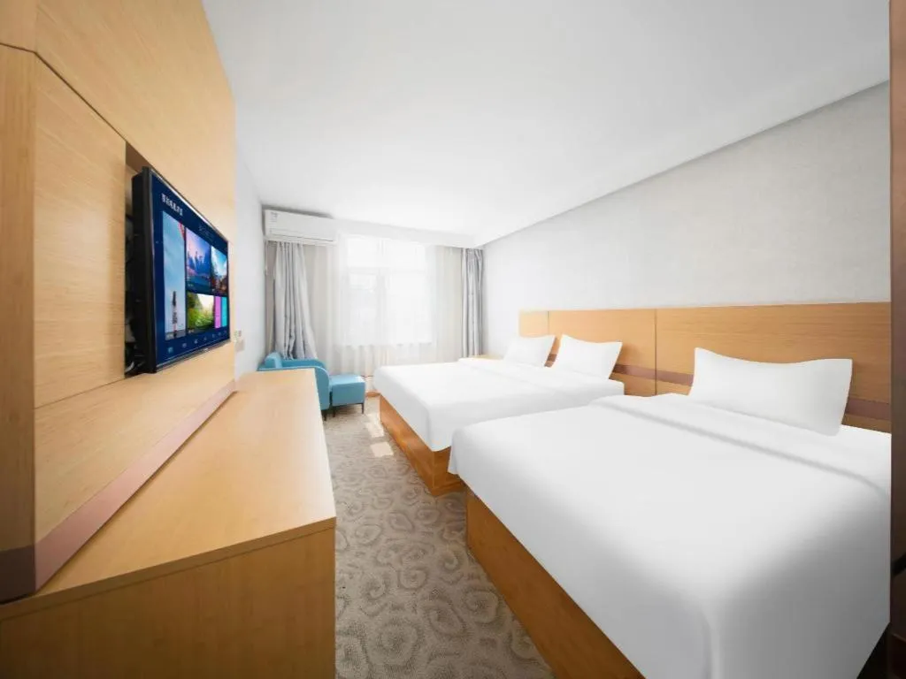 Bed in GreenTree Inn Binzhou Wudi County Yinzuo Plaza Express Hotel