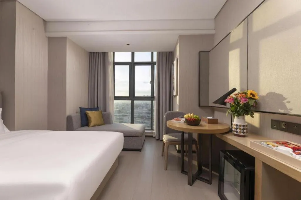 Bed in Echarm Hotel Wuxi Zhongnan Road Ancient Canal