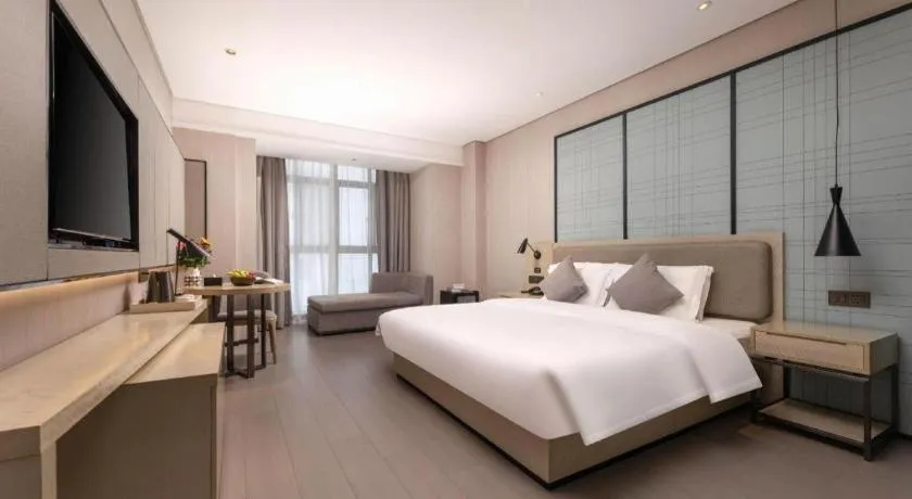 Bed in Echarm Hotel Wuxi Zhongnan Road Ancient Canal