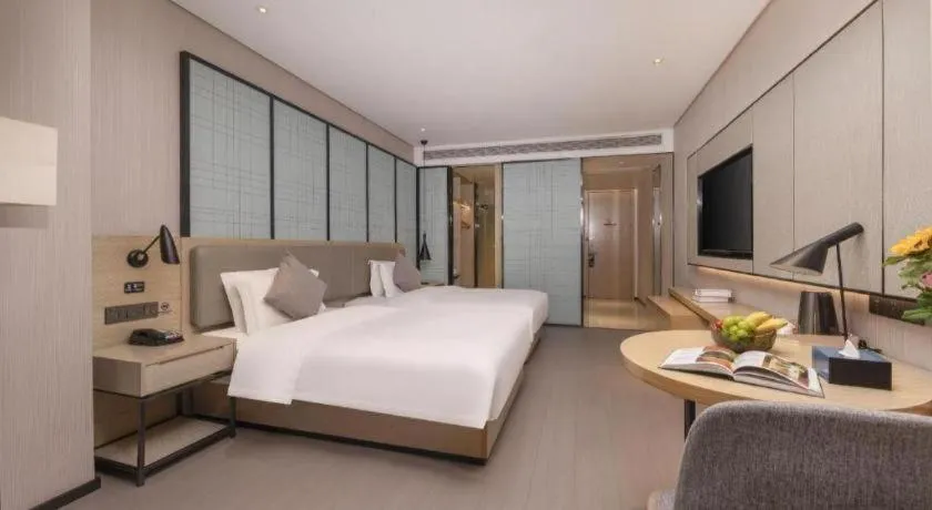 Bed in Echarm Hotel Wuxi Zhongnan Road Ancient Canal