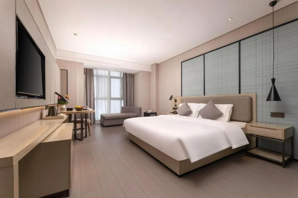 Bed in Echarm Hotel Wuxi Zhongnan Road Ancient Canal