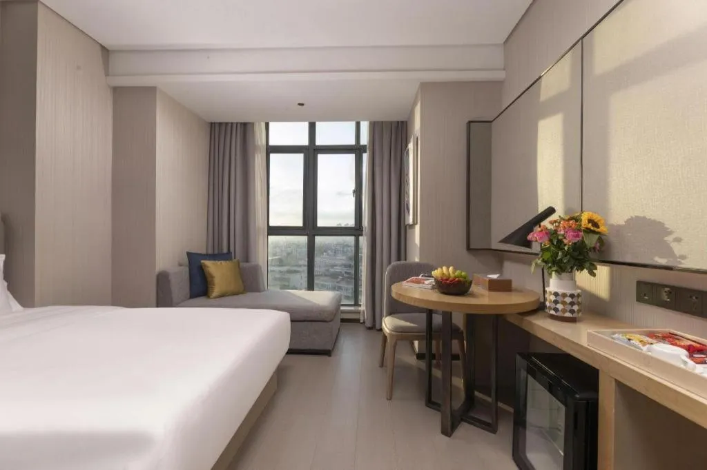 Bed in Echarm Hotel Wuxi Zhongnan Road Ancient Canal