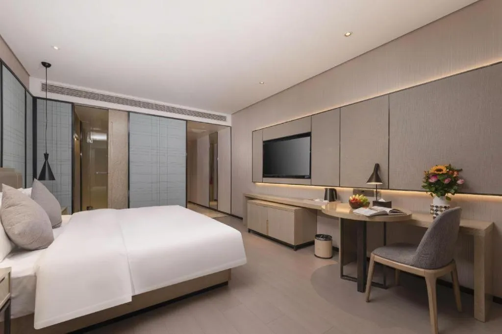 Bed in Echarm Hotel Wuxi Zhongnan Road Ancient Canal