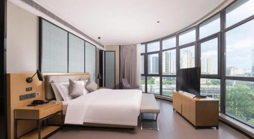 Bed in Echarm Hotel Wuxi Zhongnan Road Ancient Canal
