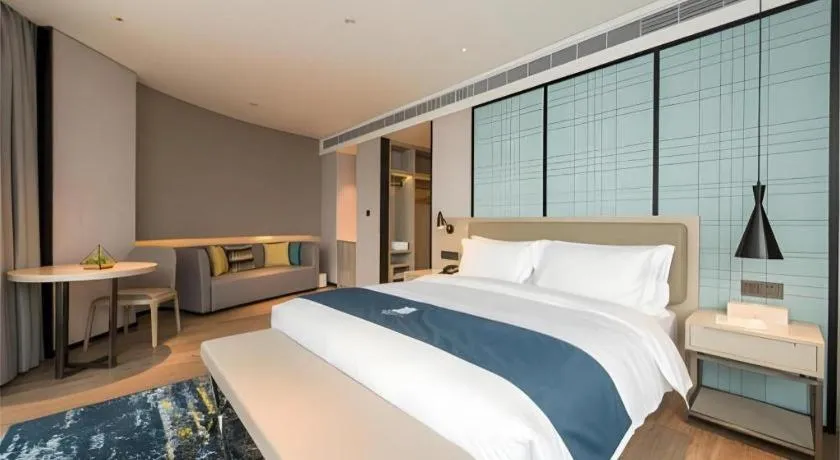 Bed in Echarm Hotel Wuxi Zhongnan Road Ancient Canal