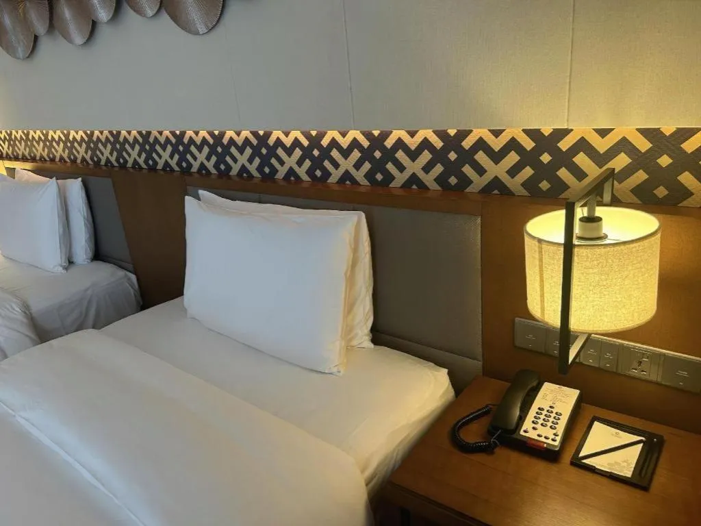 Bed in La Fountain Hotel & Resort Sanya