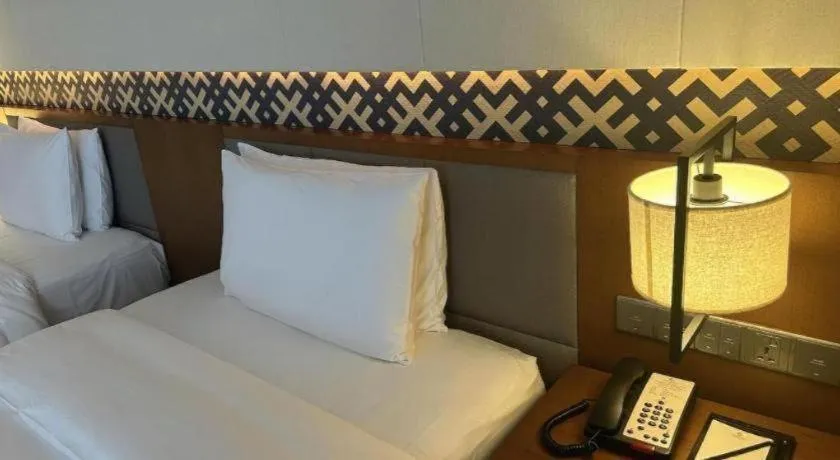 Bed in La Fountain Hotel & Resort Sanya