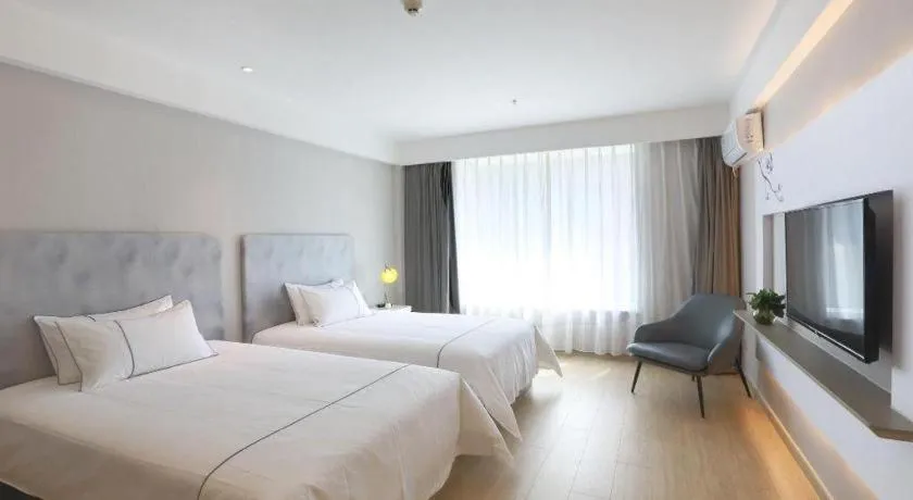 Bed in Magnotel Hotel Huizhou South Station Branch