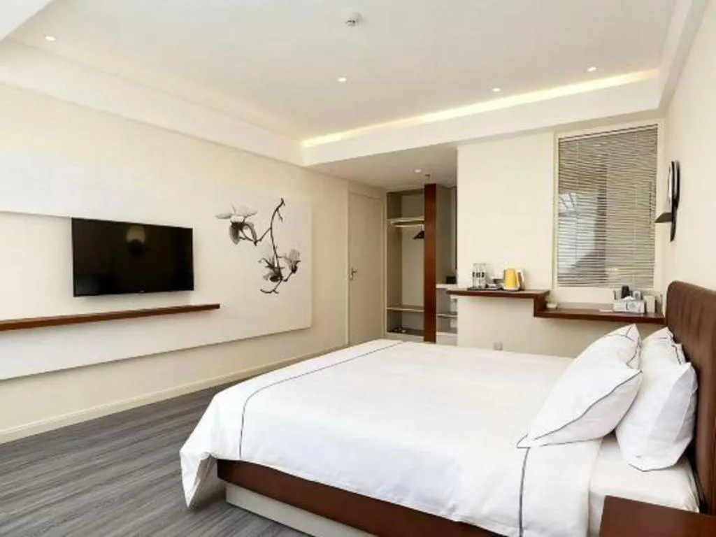 Bed in Magnotel Hotel Huizhou South Station Branch