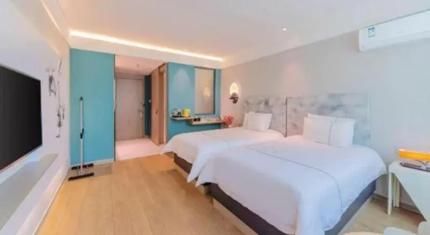 Bed in Magnotel Hotel Huizhou South Station Branch Bed in Magnotel Hotel Huizhou South Station Branch