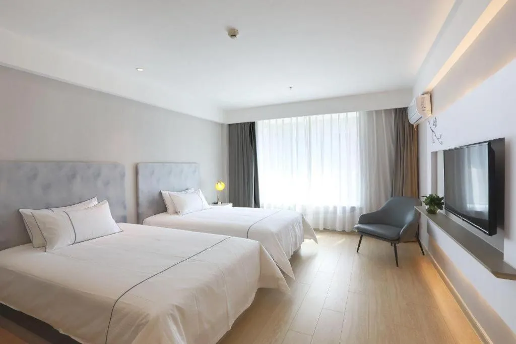 Bed in Magnotel Hotel Huizhou South Station Branch