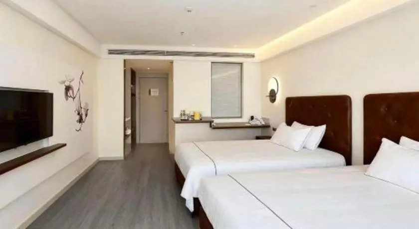 Bed in Magnotel Hotel Huizhou South Station Branch