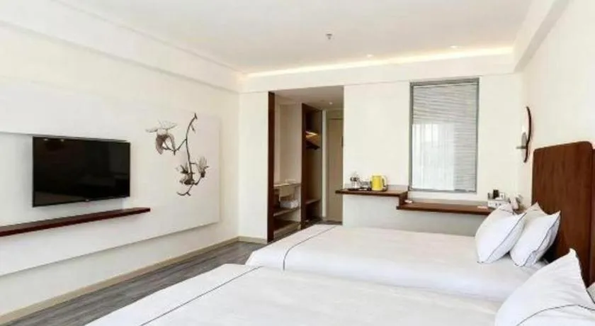 Bed in Magnotel Hotel Huizhou South Station Branch