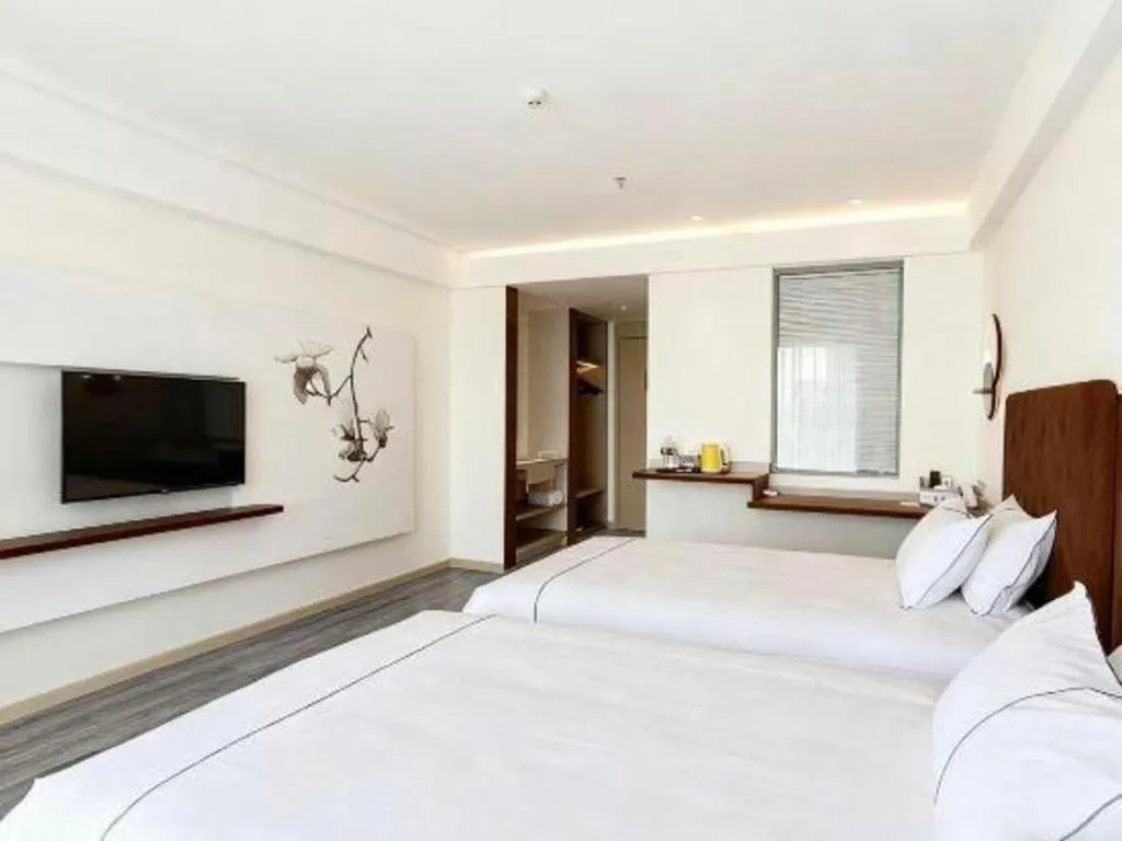 Bed in Magnotel Hotel Huizhou South Station Branch