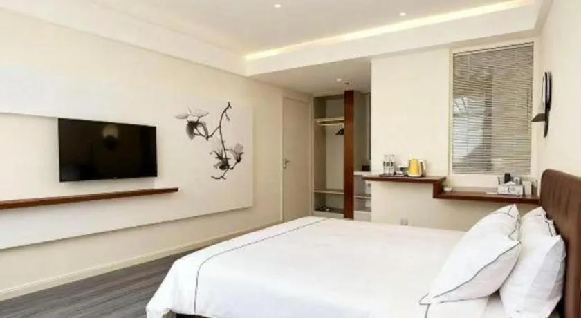 Bed in Magnotel Hotel Huizhou South Station Branch