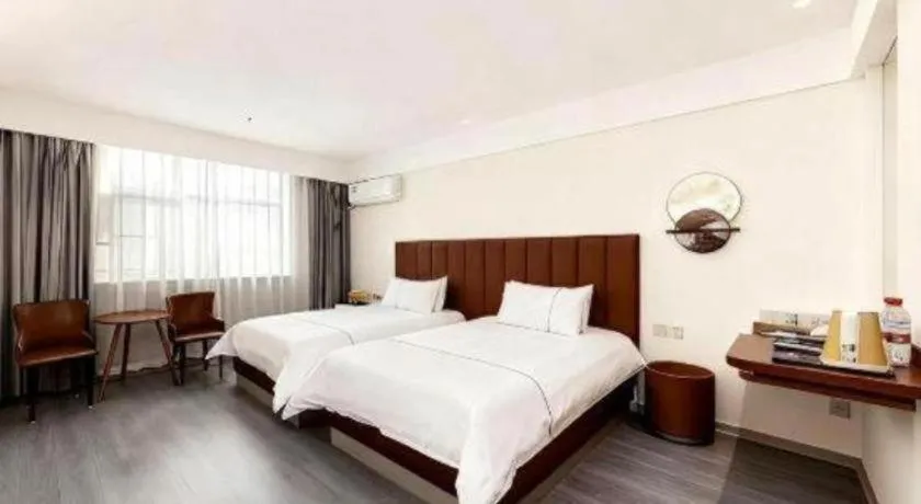 Bed in Magnotel Hotel Huizhou South Station Branch