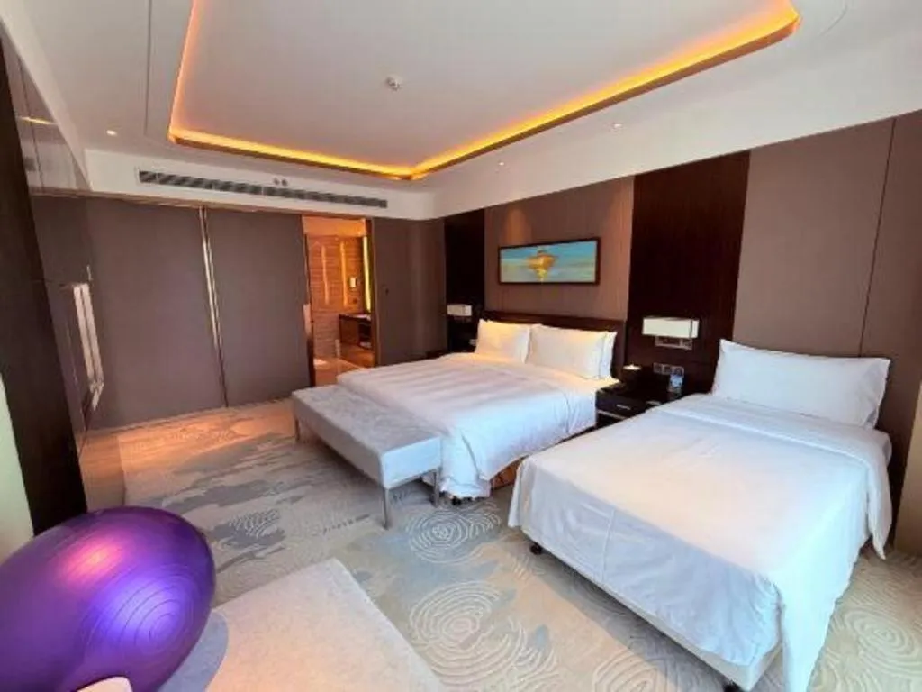 Bed in The QUBE Hotel Jingzhou
