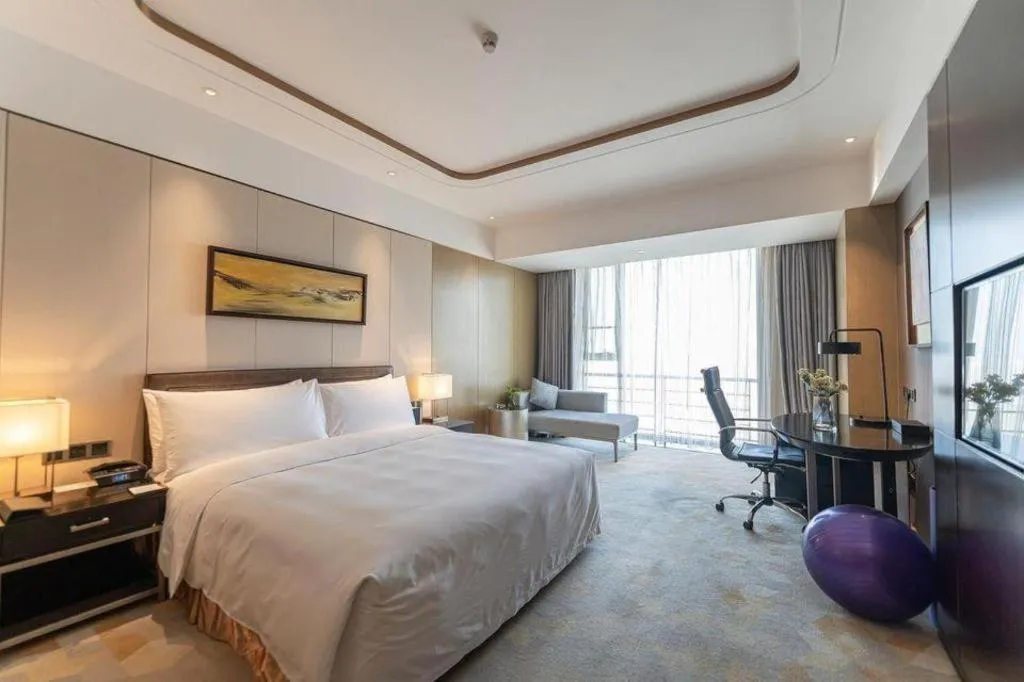 Bed in The QUBE Hotel Jingzhou