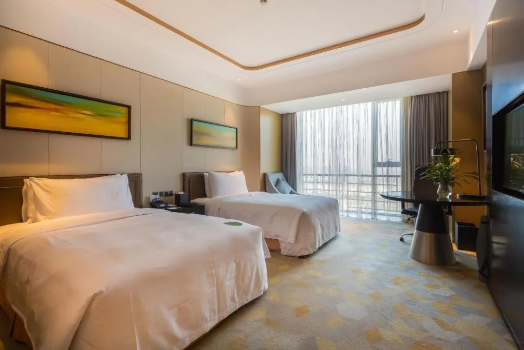 Bed in The QUBE Hotel Jingzhou