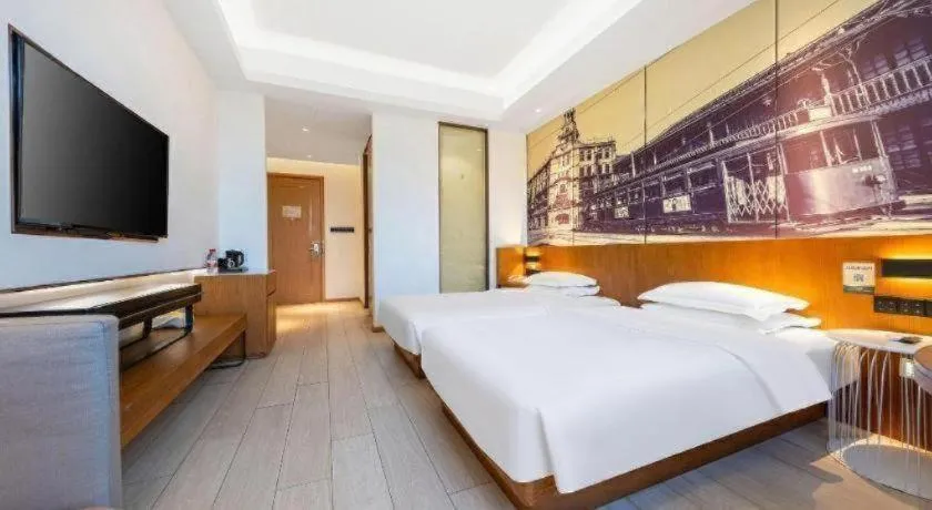Bed in Jinjiang Metropolo Hotel Shanghai Hongqiao International Exhibition Center Branch