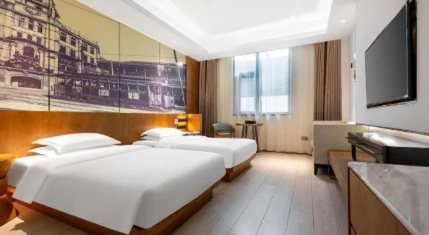 Bed in Jinjiang Metropolo Hotel Shanghai Hongqiao International Exhibition Center Branch