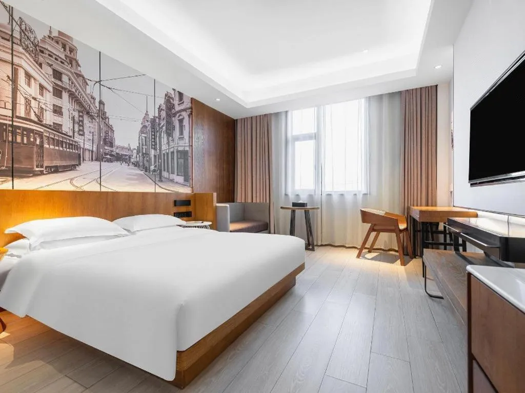 Bed in Jinjiang Metropolo Hotel Shanghai Hongqiao International Exhibition Center Branch