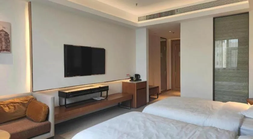 Bed in Jinjiang Metropolo Hotel Shanghai Hongqiao International Exhibition Center Branch