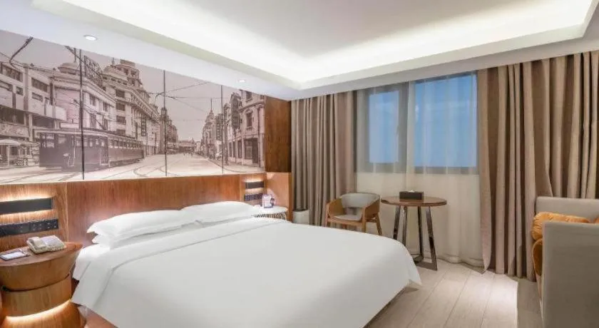 Bed in Jinjiang Metropolo Hotel Shanghai Hongqiao International Exhibition Center Branch