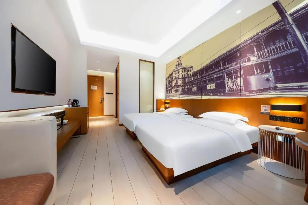 Bed in Jinjiang Metropolo Hotel Shanghai Hongqiao International Exhibition Center Branch