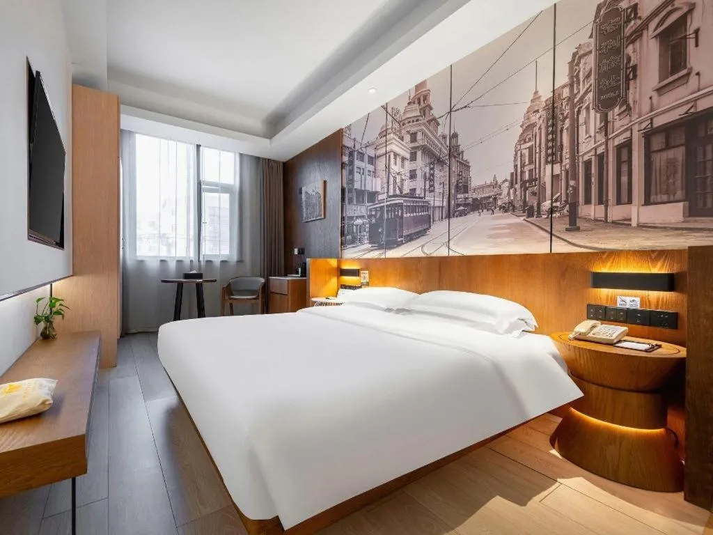 Bed in Jinjiang Metropolo Hotel Shanghai Hongqiao International Exhibition Center Branch