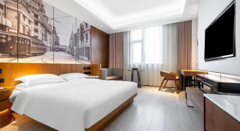 Bed in Jinjiang Metropolo Hotel Shanghai Hongqiao International Exhibition Center Branch
