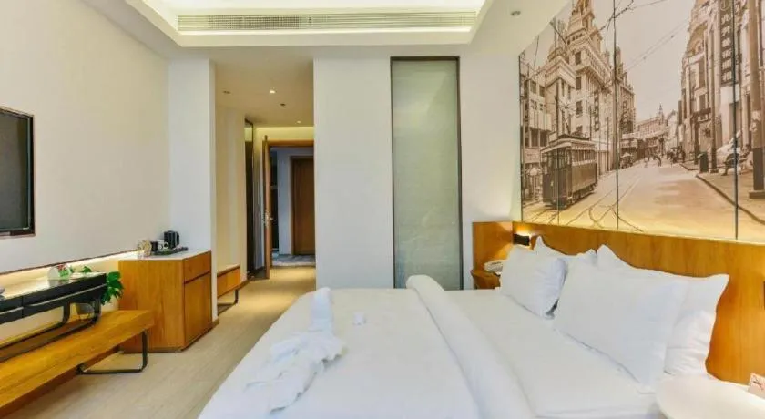 Bed in Jinjiang Metropolo Hotel Shanghai Hongqiao International Exhibition Center Branch