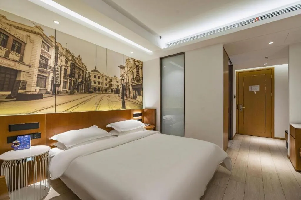 Bed in Jinjiang Metropolo Hotel Shanghai Hongqiao International Exhibition Center Branch