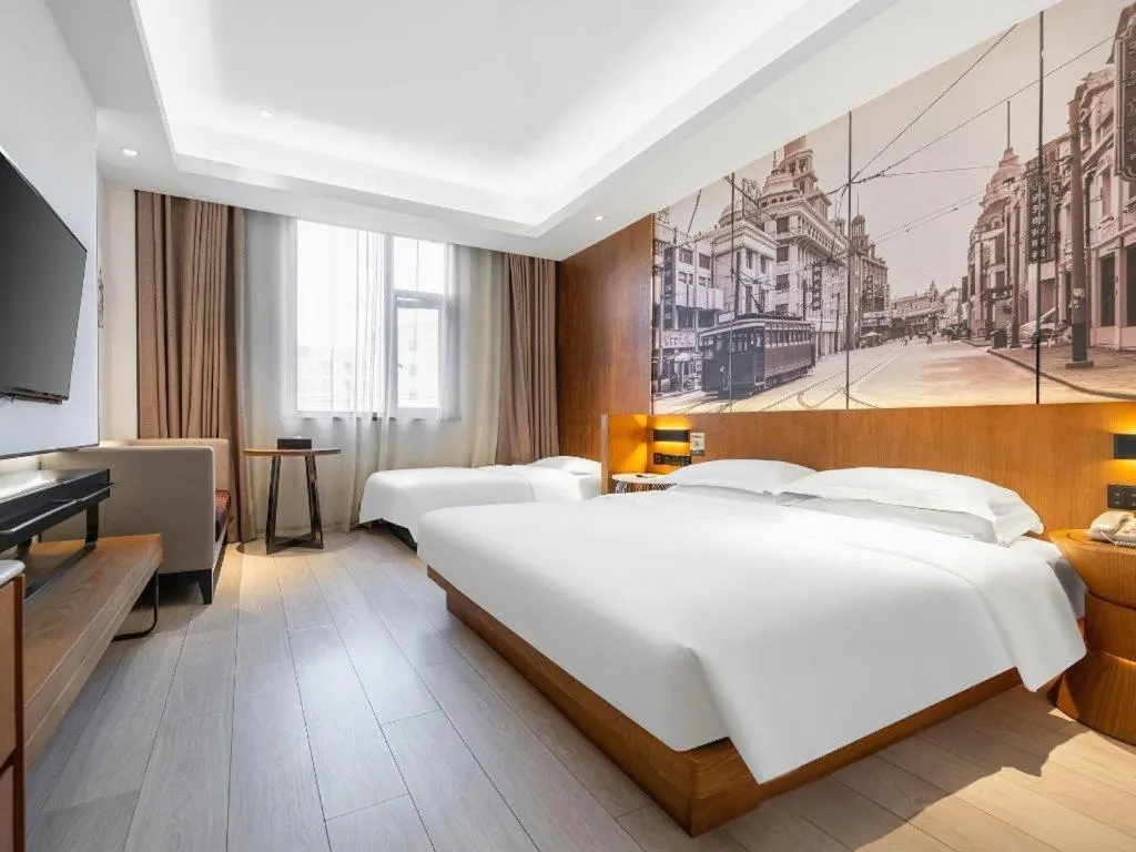 Bed in Jinjiang Metropolo Hotel Shanghai Hongqiao International Exhibition Center Branch