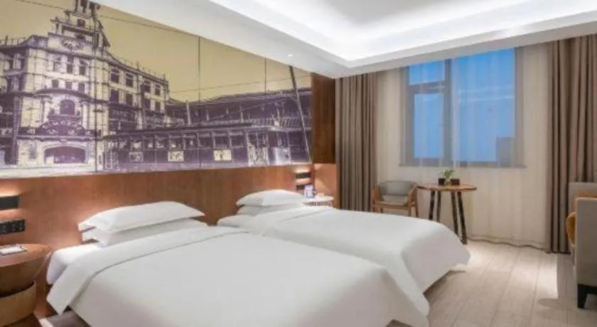 Bed in Jinjiang Metropolo Hotel Shanghai Hongqiao International Exhibition Center Branch