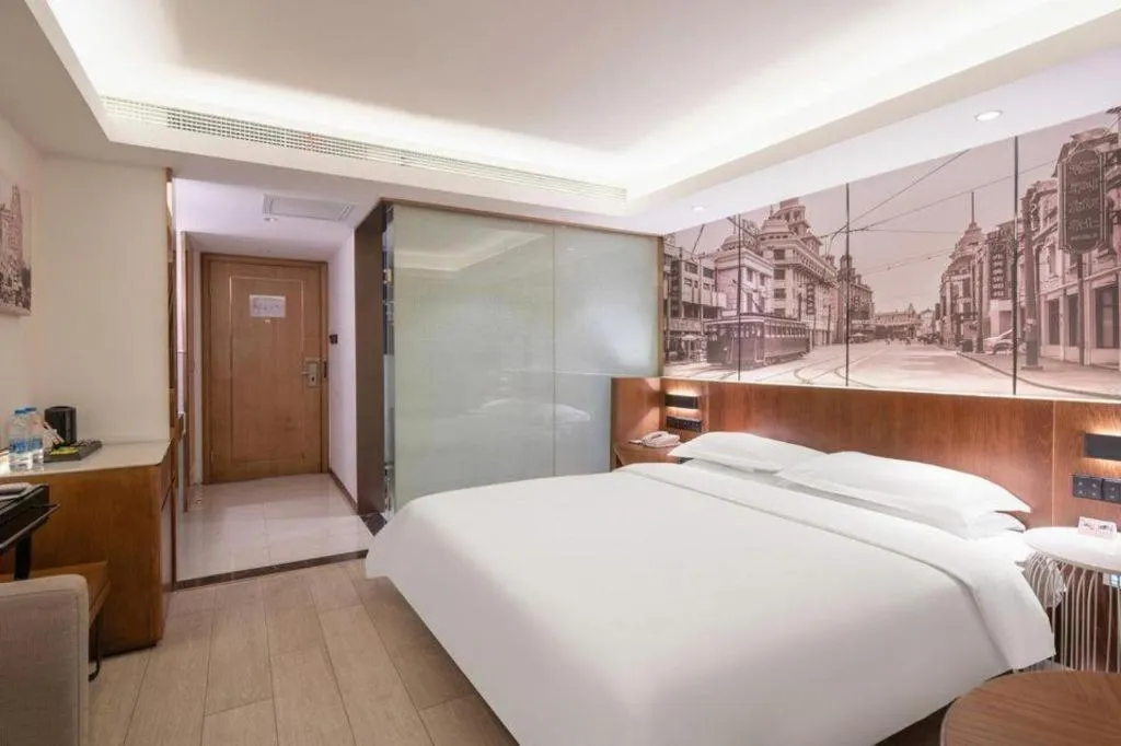 Bed in Jinjiang Metropolo Hotel Shanghai Hongqiao International Exhibition Center Branch