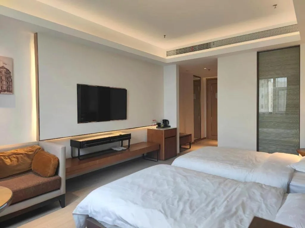 Bed in Jinjiang Metropolo Hotel Shanghai Hongqiao International Exhibition Center Branch