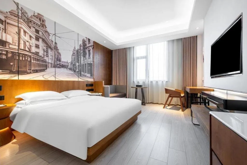 Bed in Jinjiang Metropolo Hotel Shanghai Hongqiao International Exhibition Center Branch