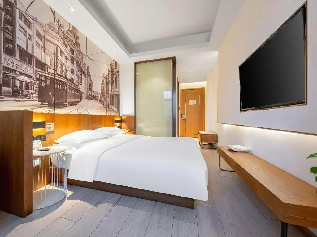 Bed in Jinjiang Metropolo Hotel Shanghai Hongqiao International Exhibition Center Branch